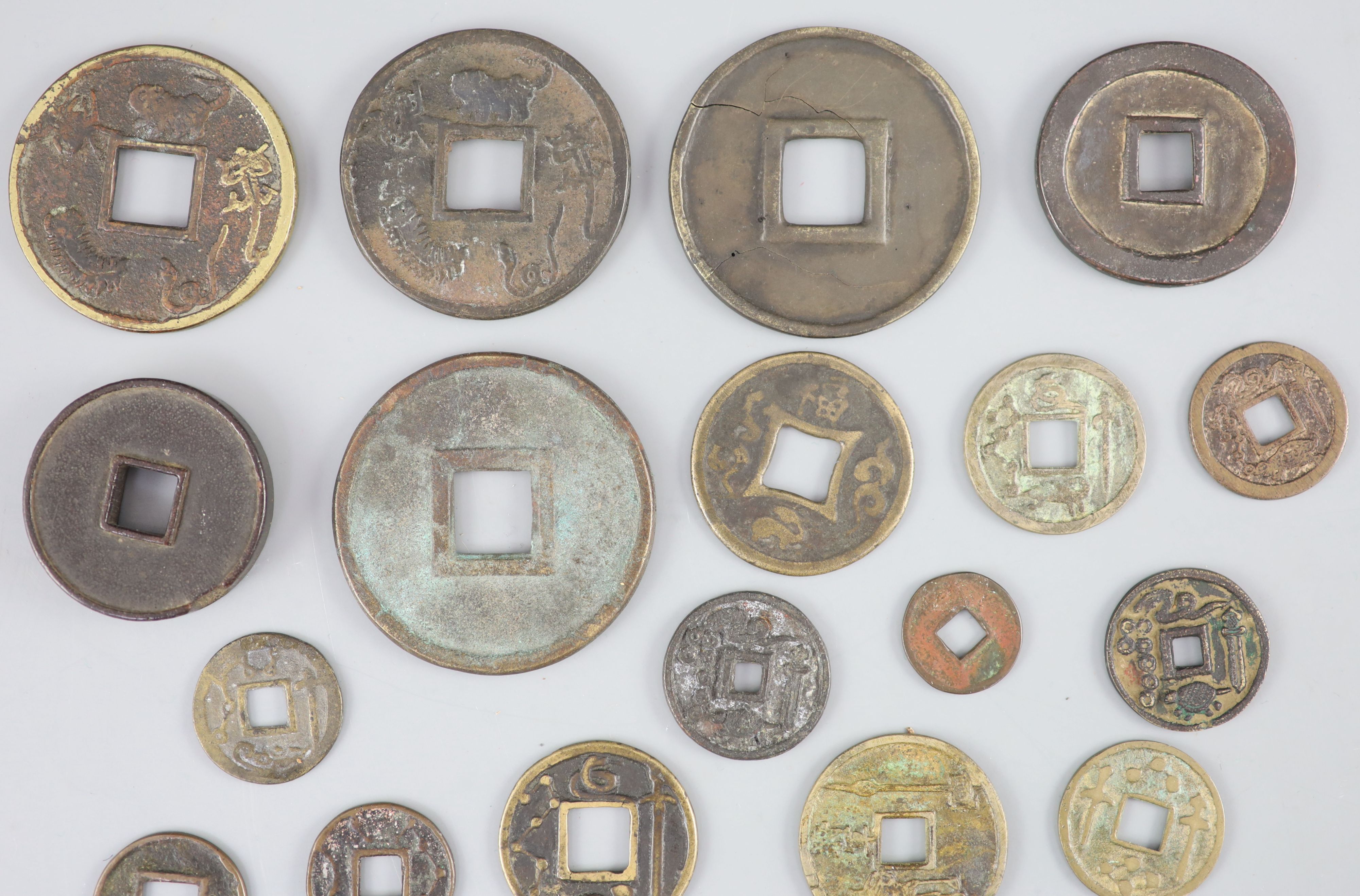 China, a group of 6 bronze coin charms or amulets, 19th century and various Thai (Siamese) porcelain gaming counters,